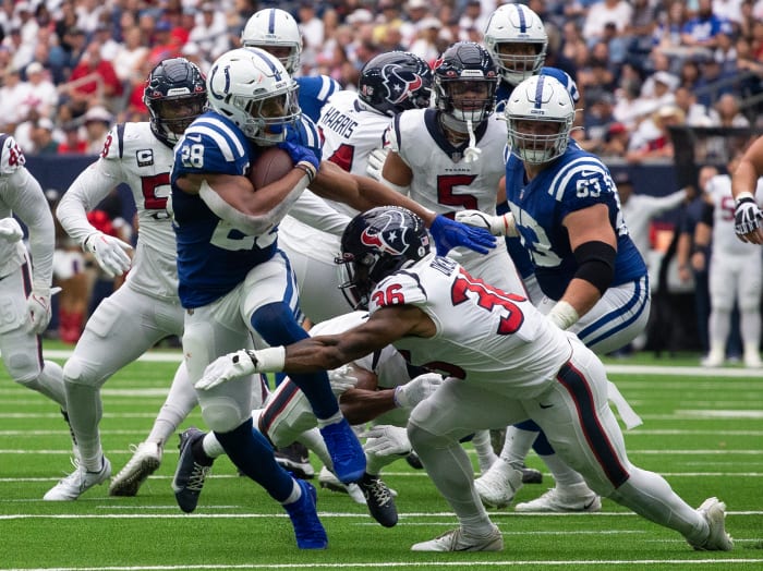 Sep 11, 2022; Houston, Texas, USA; Indianapolis Colts running back Jonathan Taylor (28) rushes against Houston Texans safety Jonathan Owens (36) in the first quarter at NRG Stadium. Mandatory Credit: Thomas Shea-USA TODAY Sports